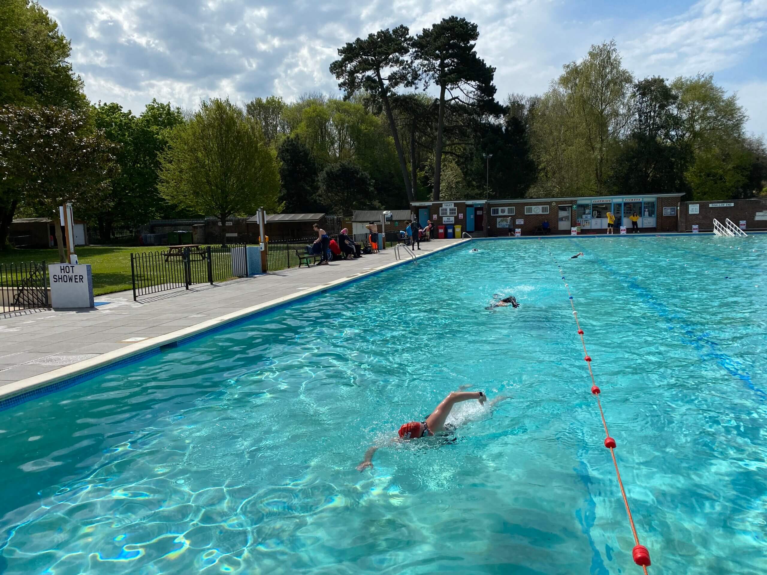 Swimmers enjoying the water at Pells Pool, Lewes, East Sussex