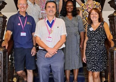 Councillors, staff and volunteers pose for a photo on the Town Hall's Jacobean Staircase during the Heritage Open Day event 2023