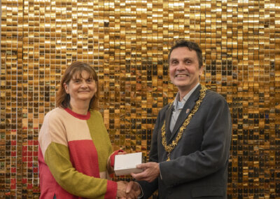 The Mayor of Lewes Cllr Matthew Bird presenting Lewes Community Fridge with a Civic Award in March 2024