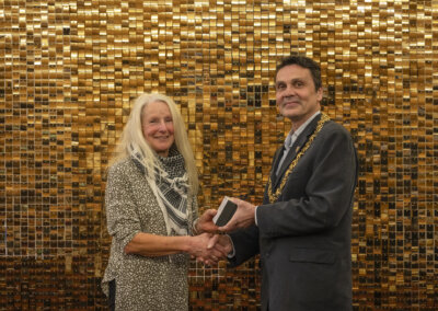 The Mayor of Lewes Cllr Matthew Bird presenting Louise Mayers with a Civic Award in March 2024