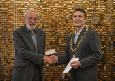 The Mayor of Lewes Cllr Matthew Bird presenting Peter Masters with a Civic Award in March 2024