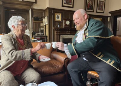 The Mayor of Lewes Councillor Imogen Makepeace with Lewes Town Crier Jon Borthwick having tea in the Mayor's Parlour